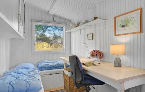 a room with a desk and a bed and a window at Gorgeous Home In Gilleleje in Gilleleje