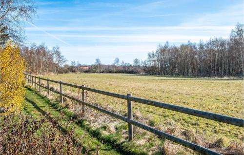 a fence in the middle of a field at Gorgeous Home In Gilleleje in Gilleleje
