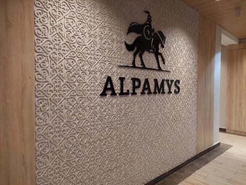 a wall with a sign that says alpangs on it at Аппартаменты рядом с ЭКСПО in Astana