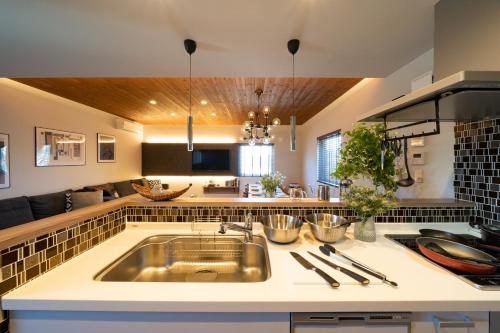 a kitchen with a sink and a counter top at Sapporo - House - Vacation STAY 88283 in Sapporo