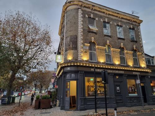 a building on the corner of a street at Horangee Pocha in London