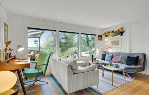 a living room with a couch and a table at Nice Home In Grevinge With Wifi in Grevinge