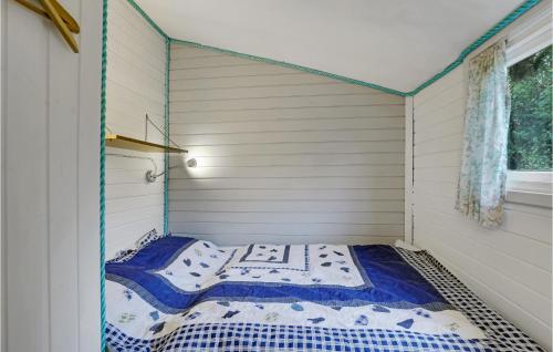 a small room with a bed in a house at Pet Friendly Home In Nexø With Wifi in Neksø
