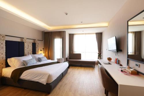 Postel nebo postele na pokoji v ubytování W3 Hotel