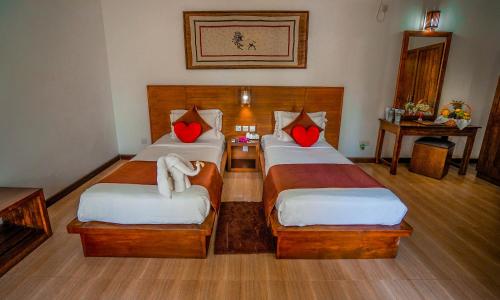 Cama o camas de una habitación en Hotel Tamarind Tree