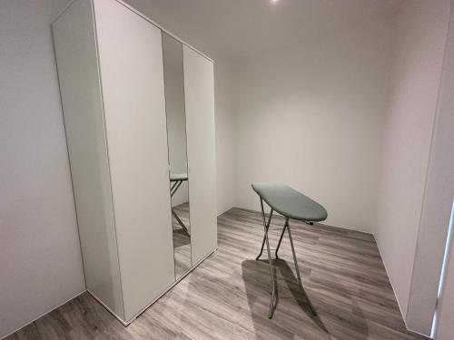 a stool in front of a mirror in a room at Lumi Tropicana in Petaling Jaya