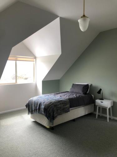 a bedroom with a bed and a window at Mondurup Escape - Kendenup in Kendenup