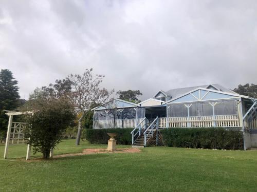 a large greenhouse in a yard with a garden at Mondurup Escape - Kendenup in Kendenup
