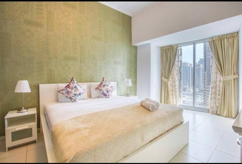 Postel nebo postele na pokoji v ubytování Cayan Tower Dubai