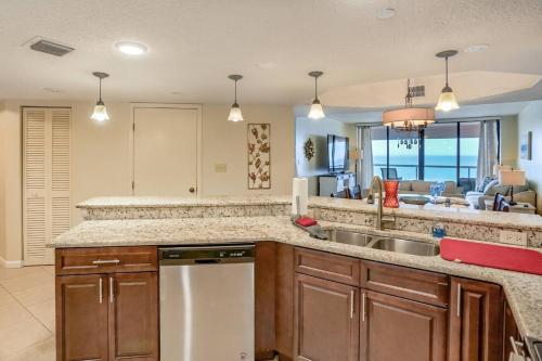 a kitchen with a sink and a counter top at 12B Crescent Beach Club in Clearwater Beach