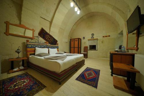 Postel nebo postele na pokoji v ubytování Fosil Cave Hotel