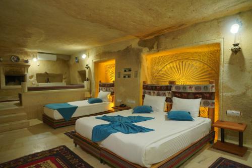 En eller flere senge i et værelse på Fosil Cave Hotel