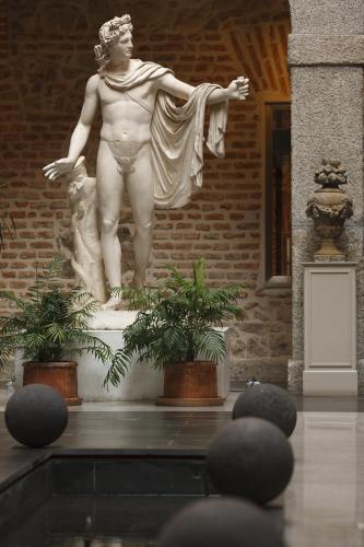 a statue of a man standing in a building at Parador de La Granja in La Granja de San Ildefonso