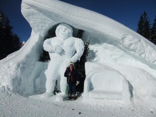 a man standing in front of a snow sculpture at Gîte Les Grands Champs in Bellentre