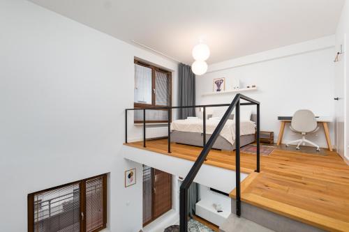 a bedroom with a bunk bed and a staircase at Pory 57 by Homeprime in Warsaw