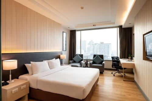 Postel nebo postele na pokoji v ubytování Jasmine Resort Bangkok