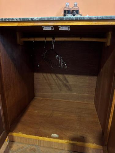 a drawer in a cabinet with a pair of shoes at Hotel Empire & Rooftop Restaurant in Bhaktapur