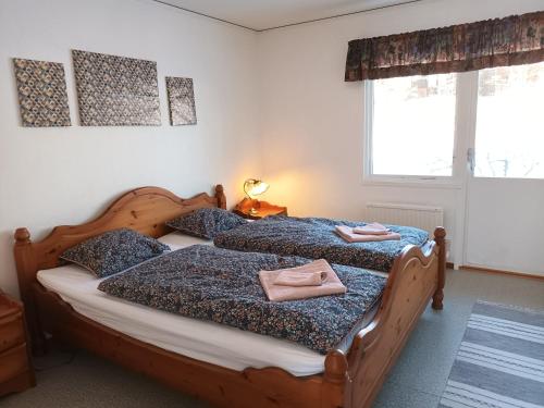 Katil atau katil-katil dalam bilik di Dals Långeds B&B