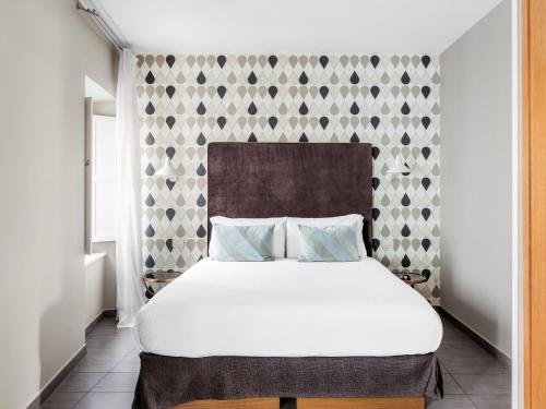 מיטה או מיטות בחדר ב-numa I Vici Rooms & Apartments