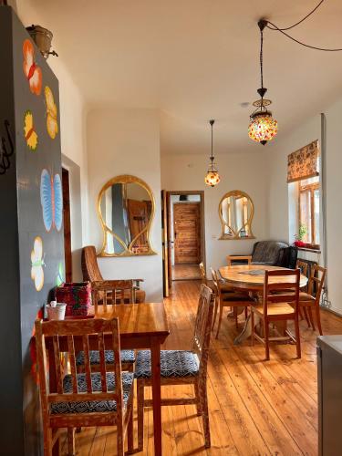 a dining room with a table and chairs at Butterfly House in Pāvilosta
