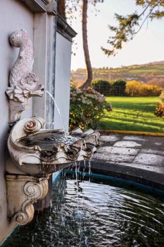a water fountain on the side of a building at The Lakeside Hotel & Leisure Centre in Killaloe