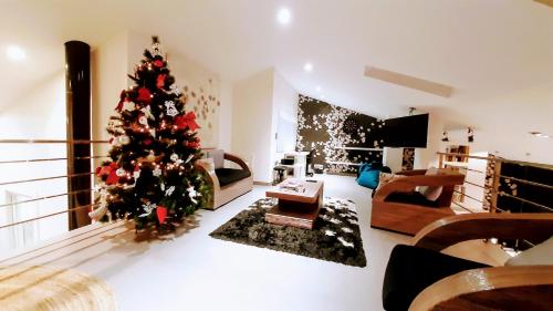 a living room with a christmas tree in it at Home VIP - Vivienda de Lujo con todo detalle in Casas Ibáñez