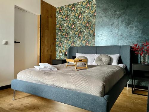 Postel nebo postele na pokoji v ubytování Apartamenty Maxa Czornyja