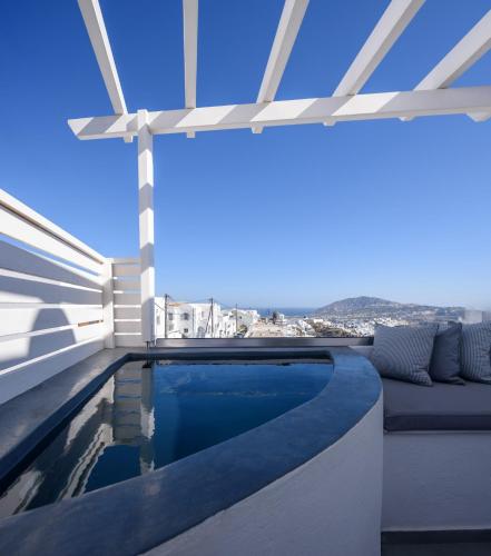 a swimming pool on the roof of a house at Senses Boutique Hotel in Imerovigli