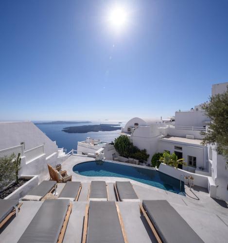 a view of the pool from the balcony of a villa at Senses Boutique Hotel in Imerovigli