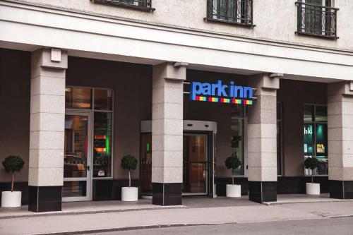 a building with a park inn sign in front of it at Park Inn by Radisson Nevsky in Saint Petersburg