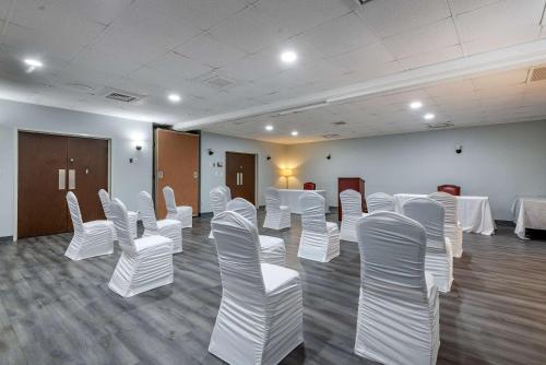 a room with white chairs and tables in it at Quality Inn Rock Hill Northeast I-77 in Rock Hill