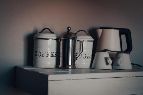 a shelf with a bunch of appliances on it at Elegant Desert Lodge in Sesriem