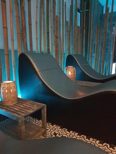 a blue slide with a wooden table and a bench at Hotel Smeraldo in Lazise