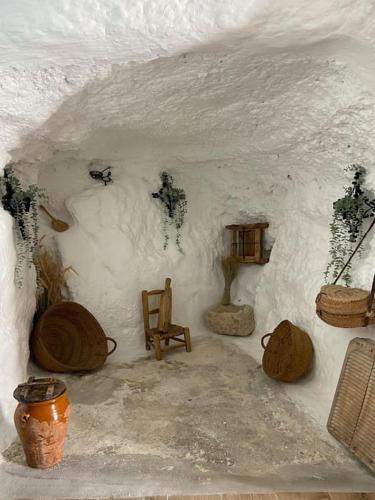 a room with a snow cave with a chair anditures at La casilla de Vicente in Torres