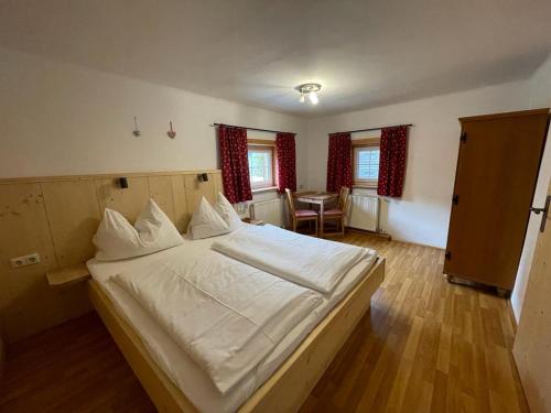 Postel nebo postele na pokoji v ubytování Müllnerhof
