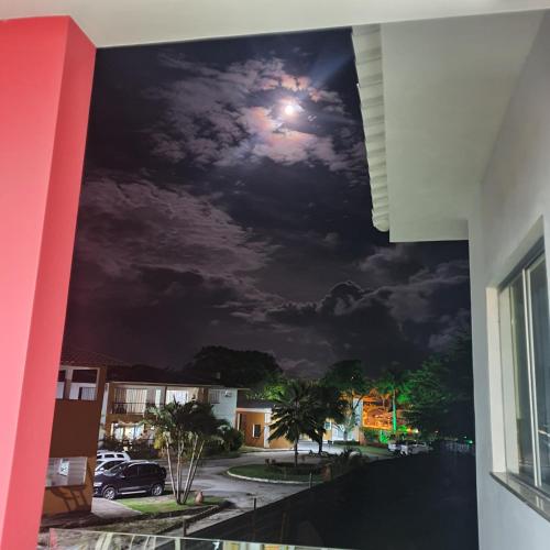 a view of a night sky from a balcony at Casa Mutá in Porto Seguro