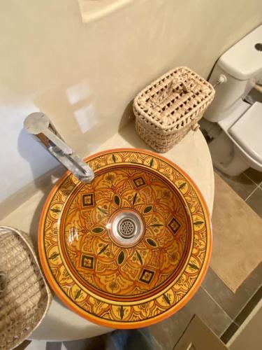 a bathroom sink with a faucet on a table at Moana Surf Maroc in Tamraght Ouzdar