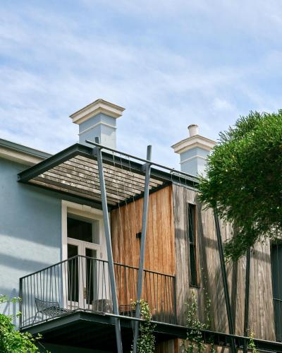a house with a balcony on the side of it at Harpers House in Cape Town
