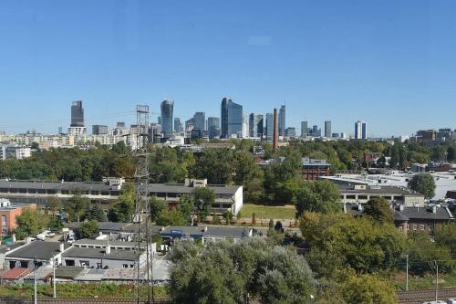a view of a city with buildings in the background at Prymasa Tysiąclecia 83A City Center View By Perfect Apart in Warsaw