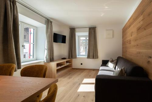 a living room with a couch and a table at Residence Kugler in San Candido