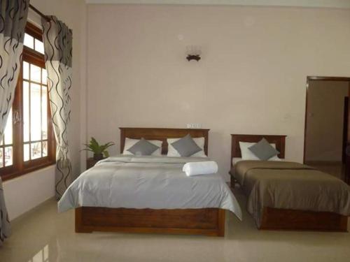 Katil atau katil-katil dalam bilik di Castlereagh Resort Hatton