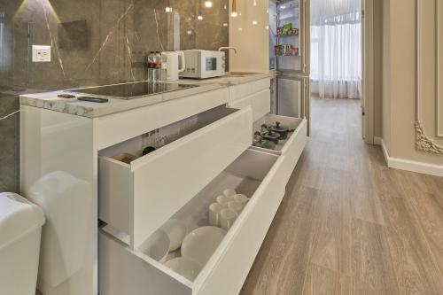 Kuchyň nebo kuchyňský kout v ubytování Olimp Hotel