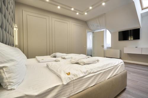 Postel nebo postele na pokoji v ubytování Olimp Hotel