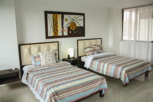Ένα ή περισσότερα κρεβάτια σε δωμάτιο στο Apartahotel Kelly