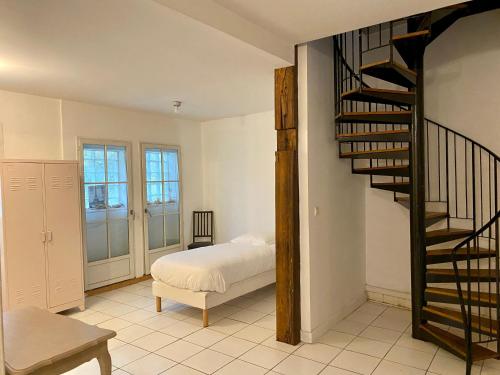 Ένα ή περισσότερα κρεβάτια σε δωμάτιο στο Residences De Chartres