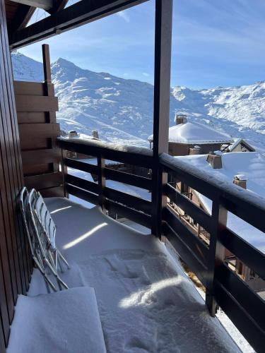 a balcony with a view of a snow covered mountain at Val Thorens Condo in Val Thorens