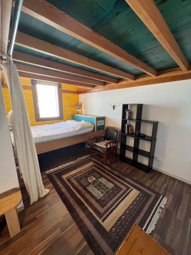 a bedroom with a bunk bed and a rug at Val Thorens Condo in Val Thorens
