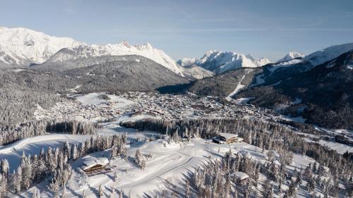 an aerial view of a ski resort in the snow at Hotel Seespitz Superior - Adults Only in Seefeld in Tirol