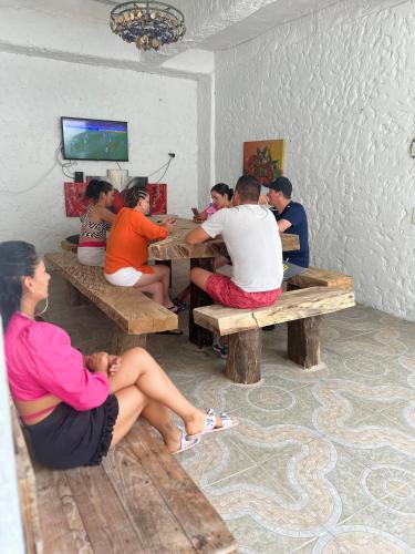 a group of people sitting at tables in a room at Casa Torices Real 12 in Cartagena de Indias