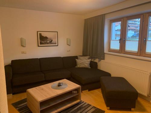 a living room with a couch and a coffee table at Haus Lawerz in Nauders
